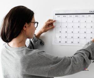 Image of woman checking calendar