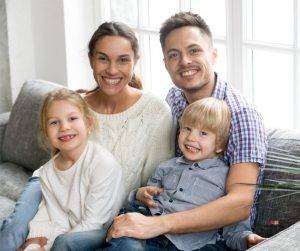 Featured image of family on sofa smiling