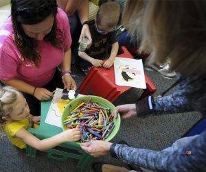 Featured image of little girl taking crayons to draw