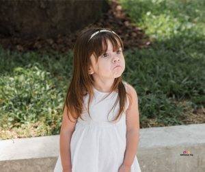 Featured image of sad little girl in white