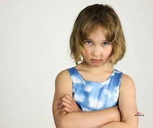 Featured image of angry girl in blue with crossed arms
