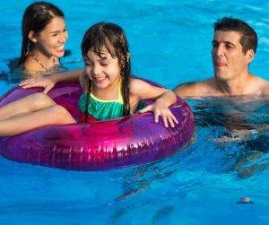 Featured image of smiling family in swimming pool