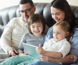 Featured image of family with two children watching movie on tablet