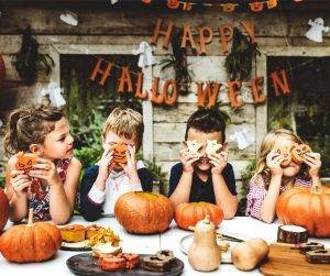 Featured image of four children at table on halloween