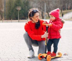 Featured image of mother and little girl in red on scooter
